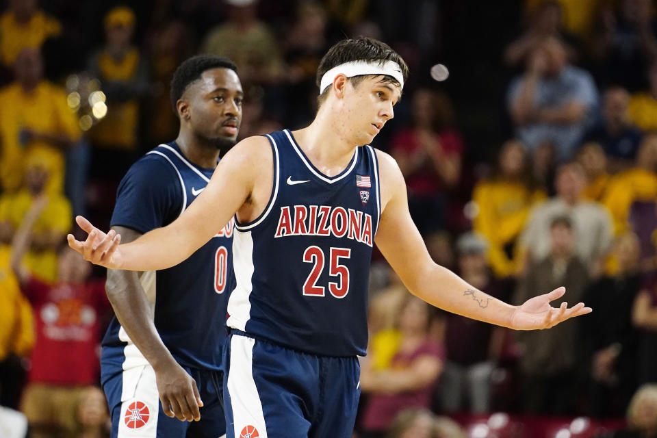 Arizona's Kerr Kris (25) gestures to Arizona State's student section toward the end of the second half of an NCAA college basketball game against Arizona State, Saturday, Dec. 31, 2022, in Tempe, Ariz. (AP Photo/Darryl Webb)