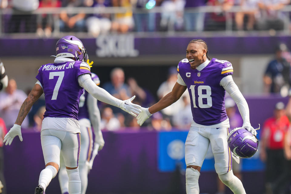 Sep 15, 2024; Minneapolis, Minnesota, USA; Minnesota Vikings wide receiver Justin Jefferson (18) celebrates an interception with cornerback Byron Murphy Jr. (7) against the San Francisco 49ers during the third quarter at US Bank Stadium. Mandatory credit: Brad Rempel-Imagn Images