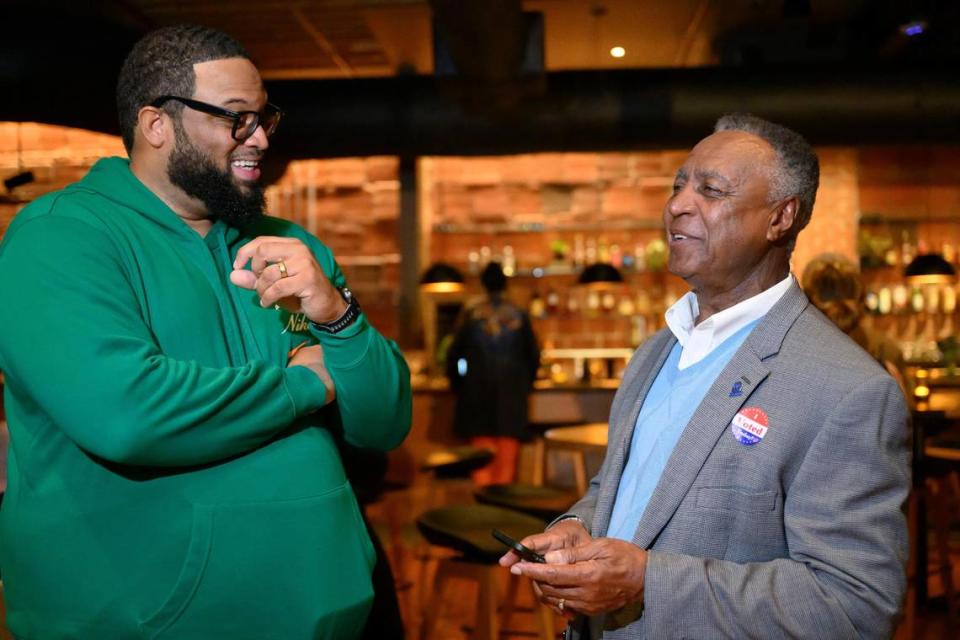 Jackson County Executive Frank White, right, talks to Tim Smith, campaign chairman for The Committee Against New Royals Stadium Taxes, left, at the Vote “no” committee watch party at Green Dirt Farm, Tuesday, April 2, 2024.