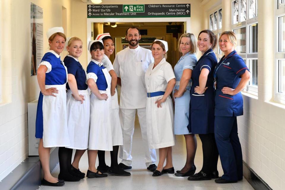 Nurses in uniforms to represent each decade of the NHS (Getty Images)