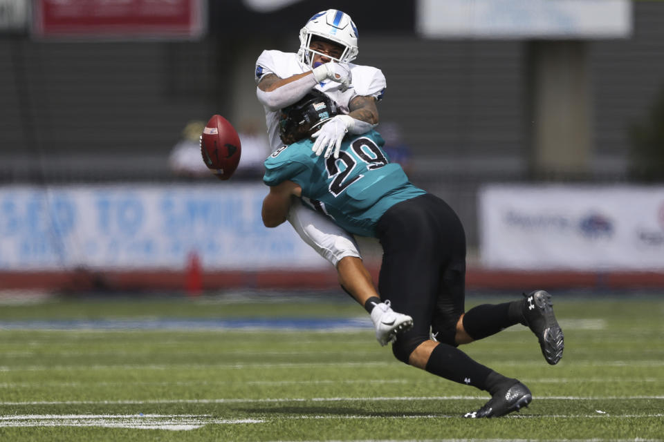 Coastal Carolina linebacker Silas Kelly (29) breaks up a pass intended for Buffalo wide receiver Dylan McDuffie during the first half of a NCAA college football game in Buffalo, N.Y. on Saturday, Sept. 18, 2021. (AP Photo/Joshua Bessex)