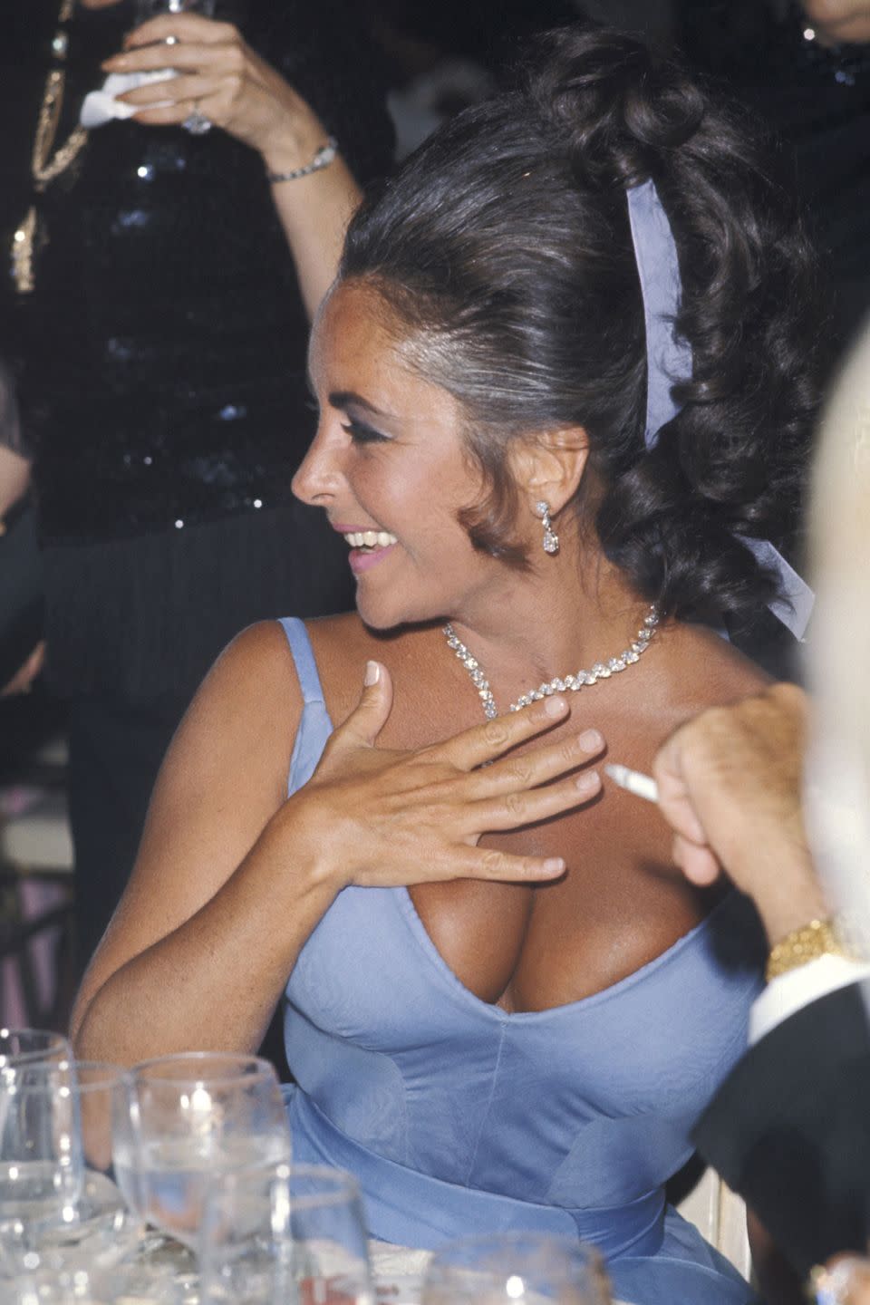 <p>Diamonds and décolletage go together like peanut butter and jelly. We'd be smiling too if we rocked this periwinkle hue as well as Liz. </p>