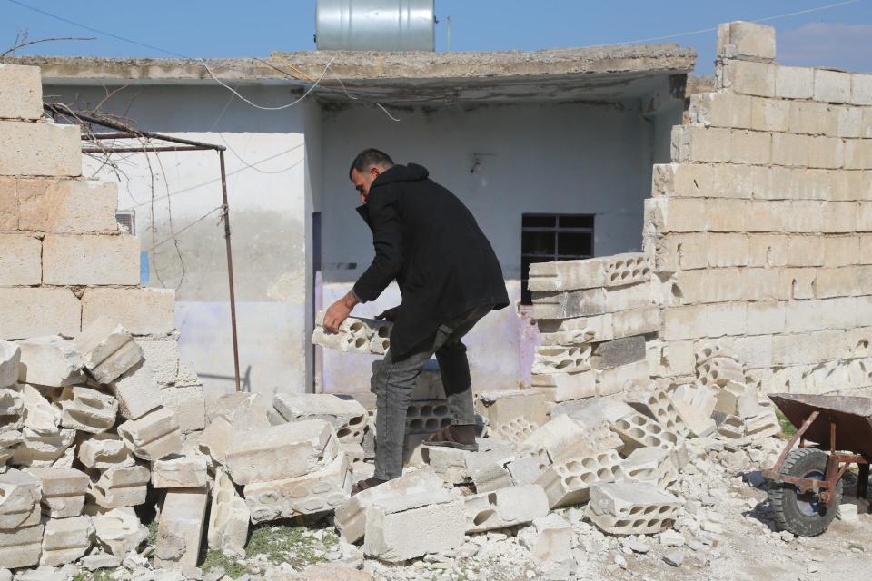 A building is destroyed after a March 11 drone attack by the Syrian army and Iranian-backed on Aleppo, Syria.