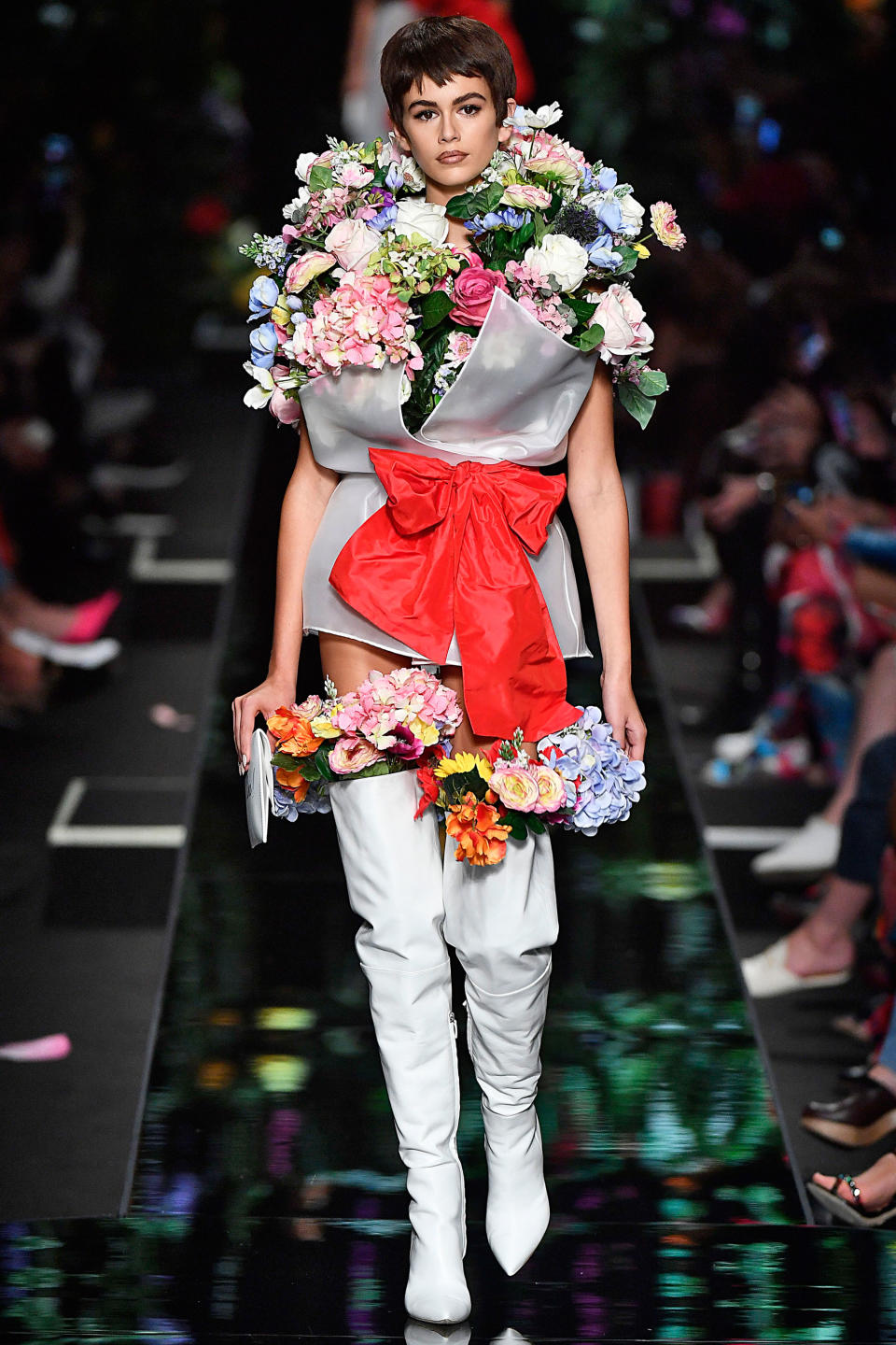 <p>Gerber also wore nothing but flowers at Moschino.</p>