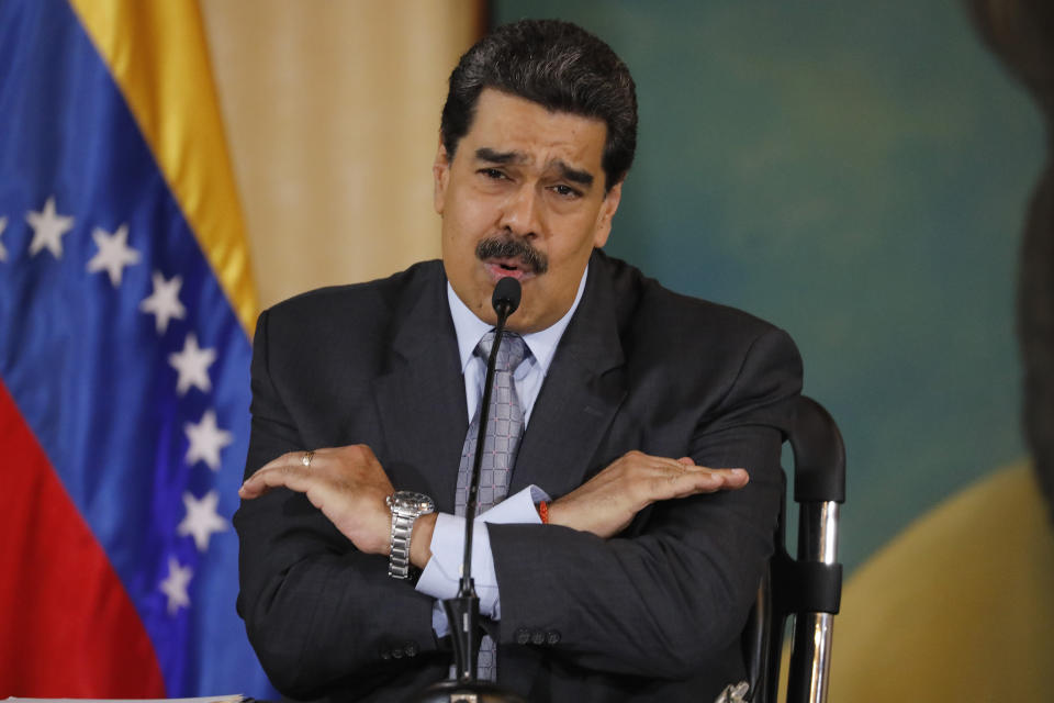 FILE - In this Sept. 30, 2019, file photo, Venezuela's President Nicolas Maduro speaks during a press conference at the Foreign Ministry in Caracas, Venezuela. The Venezuelan ambassador to Japan says his bank account has become inaccessible in Japan in what he said was apparently a consequence of President Donald Trump’s decision to freeze Venezuelan assets in the United States. The Trump administration has sought to isolate Venezuelan President Nicolas Maduro by prohibiting high-ranking loyalists from entering the U.S. and by freezing U.S. assets of many included in the no-entry list. (AP Photo/Ariana Cubillos, File)