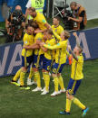 <p>Swede delight: Sweden’s players celebrate after taking the lead. (REUTERS/Lucy Nicholson) </p>