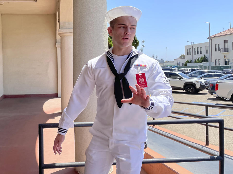 FILE - US Navy sailor Ryan Sawyer Mays walks past reporters at Naval Base San Diego before entering a Navy courtroom, Aug. 17, 2022, in San Diego. No one disputes that the Navy shares blame for the loss of the USS Bonhomme Richard, the $1.2 billion amphibious assault ship that was consumed by flames in San Diego in July 2020 as officers failed to respond quickly and its crew struggled with broken equipment. But none of that would not have happened, according to prosecution closing arguments, Thursday, Sept. 29, 2022, without Ryan Sawyer Mays. (AP Photo/Julie Watson, File)