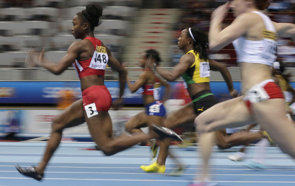 United States' Tianna Bartoletta, left, and Jamaica's Veronica Campbell-Brown compete in a women's 60m heat during the Athletics Indoor World Championships in Sopot, Poland, Saturday, March 8, 2014. (AP Photo/Matt Dunham)