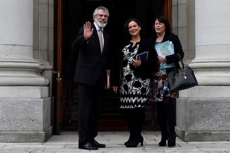 FILE PHOTO - Sinn Fein President Gerry Adams, Deputy leader Mary Lou McDonald and Michelle Gildernew wave on the steps of Government buildings ahead of a meeting with Prime Minister of Ireland Leo Varadkar in Dublin, Ireland June 16, 2017. REUTERS/Clodagh Kilcoyne