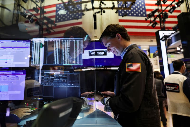 Traders work on the floor of the NYSE in New York