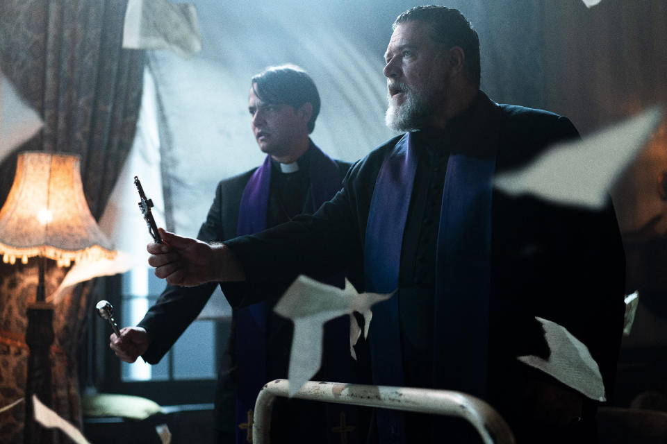 This image released by Sony Pictures shows Daniel Zovatto, left, and Russell Crowe in a scene from Screen Gems' "The Pope's Exorcist." (Jonathan Hession/Sony Pictures via AP)