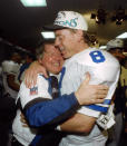 FILE - In this Sunday, Jan. 30, 1994, file photo, Dallas Cowboys' head coach Jimmy Johnson hugs quarterback Troy Aikman in their locker room after defeating the Buffalo Bills 30-13 in Super Bowl XXVIII at the Georgia Dome in Atlanta. “Jimmy was a Hall of Fame personnel guy,” Aikman said. “One of his greatest strengths was his ability to evaluate talent and maneuver draft picks — all those things set him up to be a Hall of Fame coach.”(AP Photo/Charles Krupa, File)