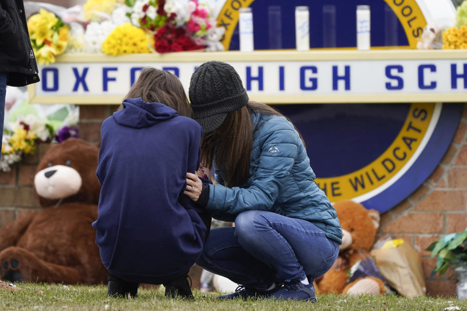 Mourners grieve at Oxford High School in Oxford, Mich. (Paul Sancya / AP file)