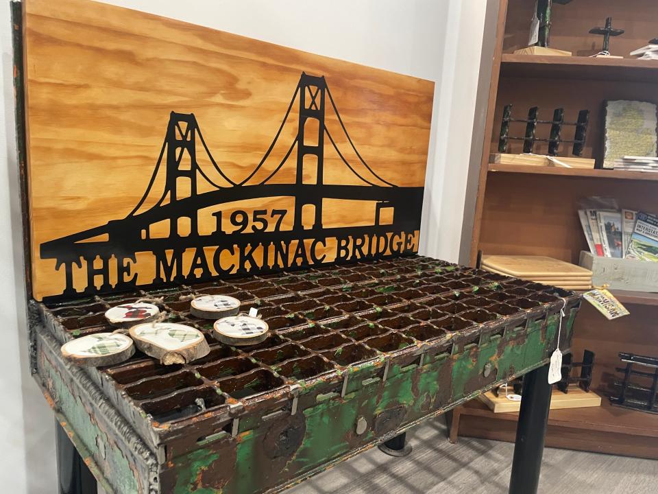 A table and decorations made from former grates on the Mackinac Bridge at A Gathered Collection in Brighton.