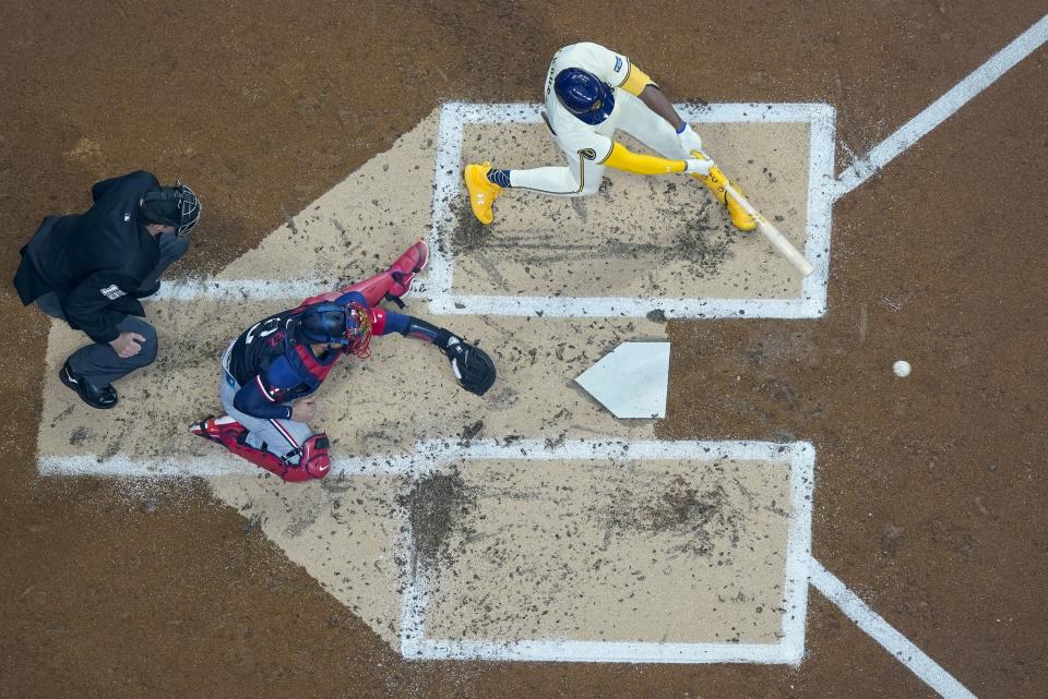 Milwaukee Brewers' Jackson Chourio hits an RBI single during the second inning of a baseball game against the Minnesota Twins Tuesday, April 2, 2024, in Milwaukee. (AP Photo/Morry Gash)