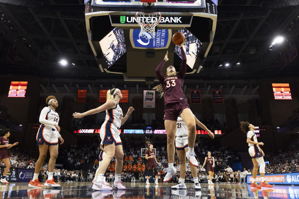 Virginia Tech's Elizabeth Kitley (33) shoots the ball during the first half of an NCAA college basketball game against Virginia, Sunday, March. 3, 2024, in Charlottesville, Va. (AP Photo/Mike Kropf)