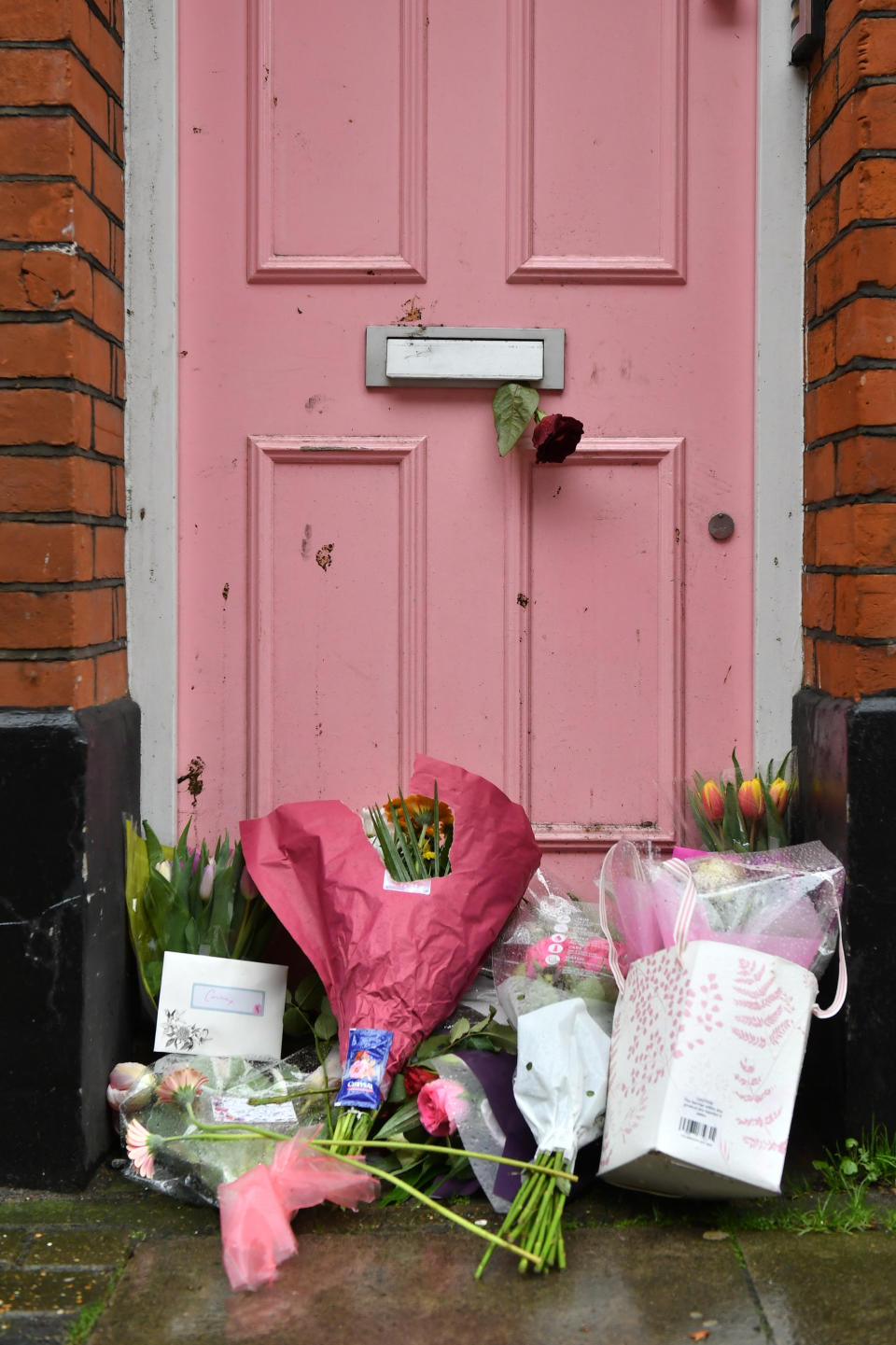 Floral tributes placed outside Caroline Flack's former home in North London. (Photo by Dominic Lipinski/PA Images via Getty Images)