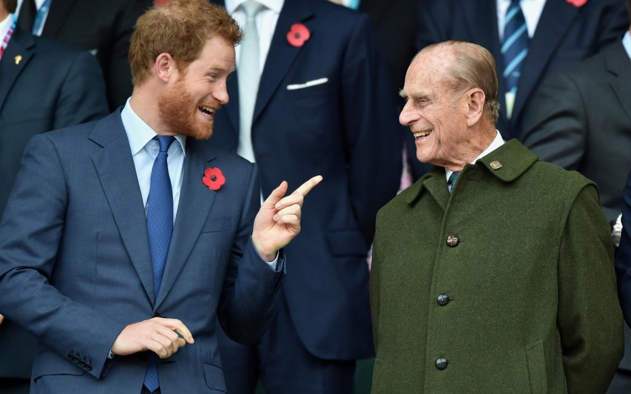 Prince Harry & Prince Philip, Duke of Edinburgh attend the 2015 Rugby World Cup Final - Max Mumby 