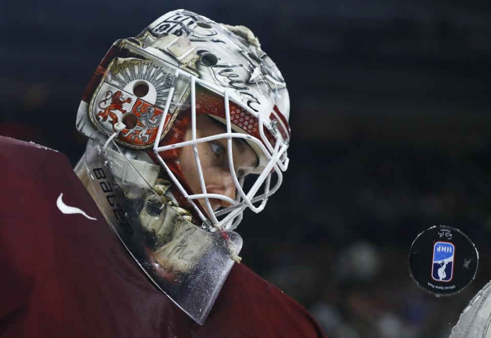 <p>Goalkeeper Elvis Merzlikins of Latvia looks at the puck at the 2017 IIHF World Championships in Cologne, Germany on May 13, 2017. (Photo: Wolfgang Rattay/Reuters) </p>