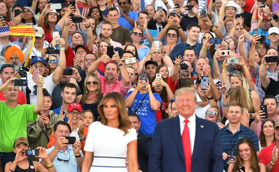 Guest cheer as US President Donald Trump and First Lady Melania Trump arrive for the "Salute to America" Fourth of July event at the Lincoln Memorial in Washington, DC, July 4, 2019. (Photo by MANDEL NGAN / AFP)        (Photo credit should read MANDEL NGAN/AFP/Getty Images)