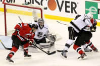 NEWARK, NJ - JUNE 02: Zach Parise #9 of the New Jersey Devils goes for a loose puck in front of Jonathan Quick #32 of the Los Angeles Kings during Game Two of the 2012 NHL Stanley Cup Final at the Prudential Center on June 2, 2012 in Newark, New Jersey. (Photo by Jim McIsaac/Getty Images)