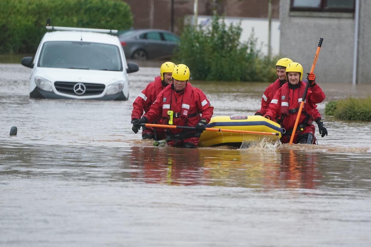 Members of a Coastguard Rescue Team helped residents in Brechin (PA Wire)