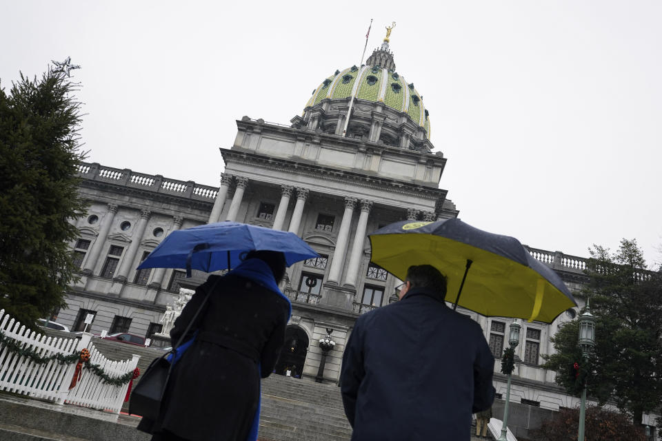 Visitors enter the Capital as legislators of the Pennsylvania House of Representatives are to be sworn-in, Tuesday, Jan. 3, 2023, at the state Capitol in Harrisburg, Pa. The ceremony marks the convening of the 2023-2024 legislative session of the General Assembly of Pennsylvania. (AP Photo/Matt Smith)