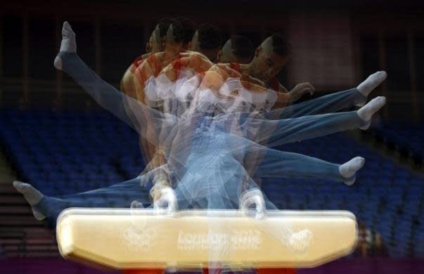 Louis Smith of Britain practices on the pommel horse during a training session at the O2 Arena before the start of the London 2012 Olympic Games in London July 25, 2012.