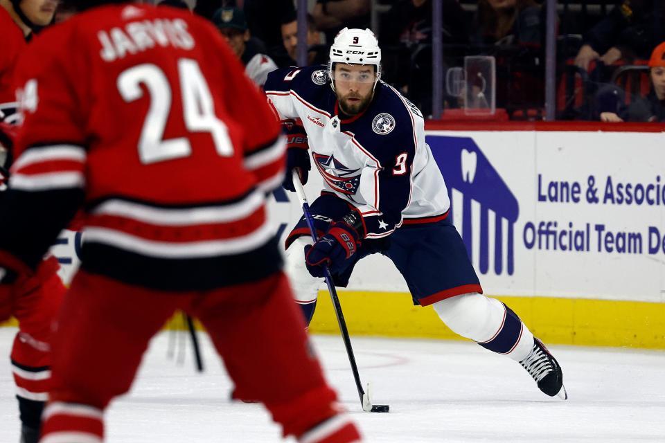 Columbus Blue Jackets' Ivan Provorov (9) moves the puck against the Carolina Hurricanes during the first period of an NHL hockey game in Raleigh, N.C., Sunday, Nov. 26, 2023. (AP Photo/Karl B DeBlaker)