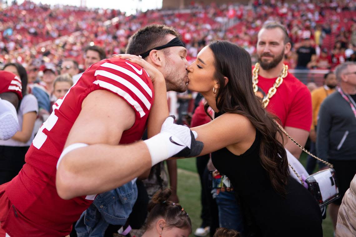 San Francisco 49ers fullback Kyle Juszczyk kisses his wife, Kristin Juszczyk, before the New Orleans Saints game in November.