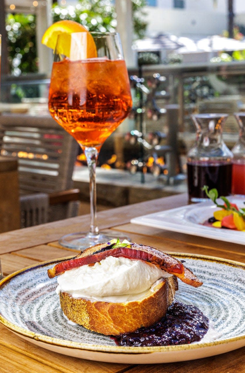 Burrata toast and Aperol spritz cocktails are served at Galley during the restaurant's Sunday "Bottomless Brunch".