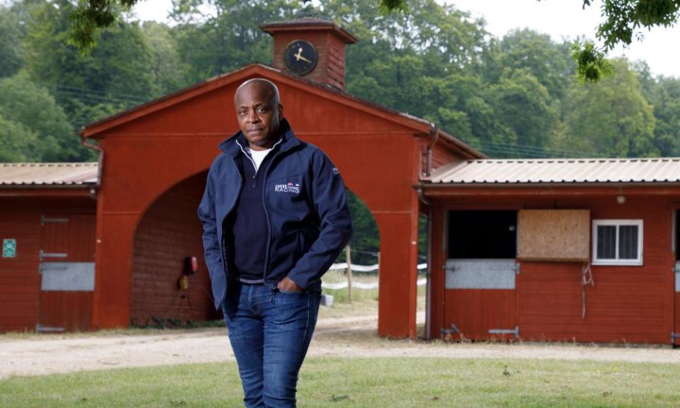 Paul Parker poses for a portrait at the yard of racehorse trainer Robyn Brisland, where his racing club own a string of horses.