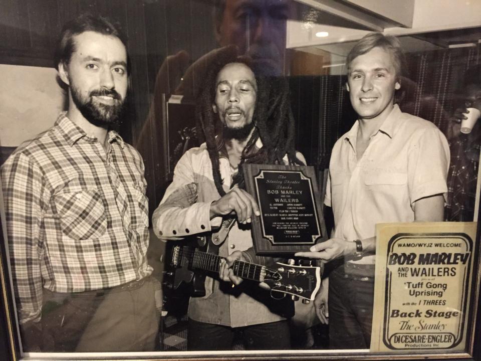 At his final concert, Bob Marley, center, receives a plaque from Pittsburgh concert promoter Rich Engler (right) and DiCesare-Engler production manager Ed Traversari (left).