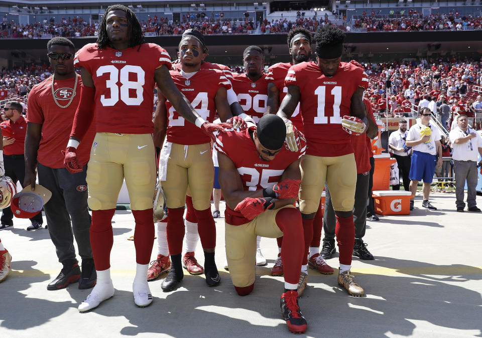 <p>San Francisco 49ers safety Eric Reid (35) kneels in front of teammates during the playing of the national anthem before an NFL football game between the 49ers and the Carolina Panthers in Santa Clara, Calif., Sunday, Sept. 10, 2017. (AP Photo/Marcio Jose Sanchez) </p>