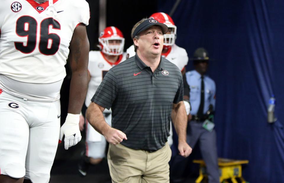 The Georgia Bulldogs are led by coach Kirby Smart, who like Jim Harbaugh, is now coaching his alma mater. He's 64-15 in six seasons at Georgia, including now five straight New Years Six bowl game berths and second spot in the College Football Playoff.