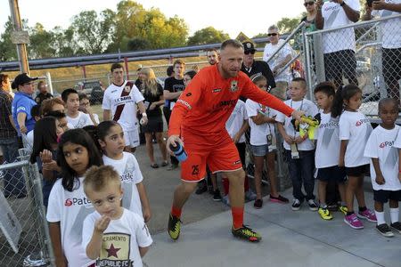 Sacramento Republic FC goalkeeper Dominik Jakubek runs onto Bonney Field, the team's home pitch, in Sacramento, California August 27, 2014. REUTERS/Robert Galbraith