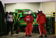 DAYTONA BEACH, FL - FEBRUARY 27: Crew members work on the #10 GoDaddy.com Chevrolet driven by Danica Patrick in the garage after being involved in an on track incident during the NASCAR Sprint Cup Series Daytona 500 at Daytona International Speedway on February 27, 2012 in Daytona Beach, Florida. (Photo by Jerry Markland/Getty Images for NASCAR)