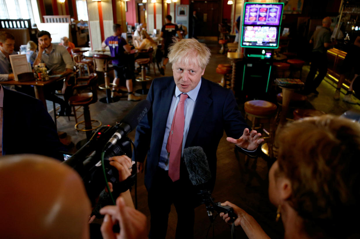 Mr Johnson, pictured campaigning in a Wetherspoons pub, revealed his favourite drink in an interview with Politico (Getty Images)