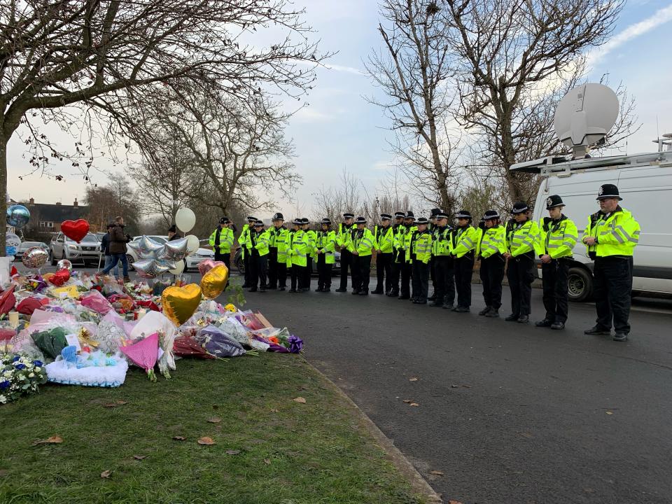 21 Officers from West Midlands Police lay bouquets of flowers and stood in silence near to the scene in Babbs Mill Park in Kingshurst, Solihull, after the deaths of three boys aged eight, 10 and 11 who fell through ice into a lake in the West Midlands. Picture date: Tuesday December 13, 2022. (Photo by Richard Vernalls/PA Images via Getty Images)