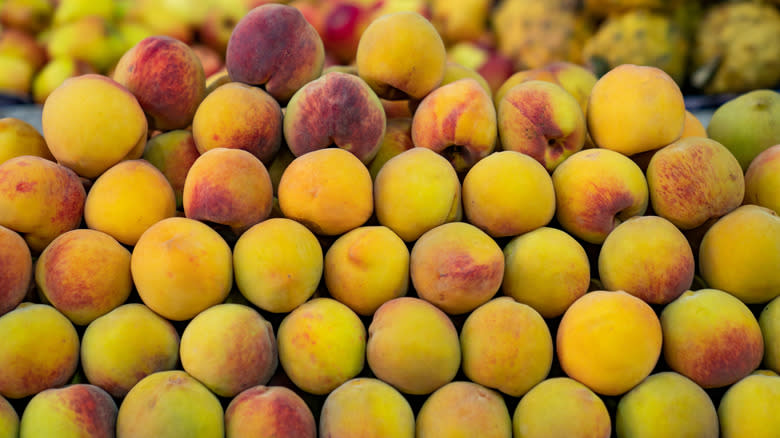 pile of peaches in supermarket