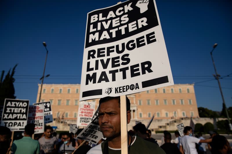 FILE PHOTO: Refugees and migrants demonstrate outside the Greek parliament in Athens