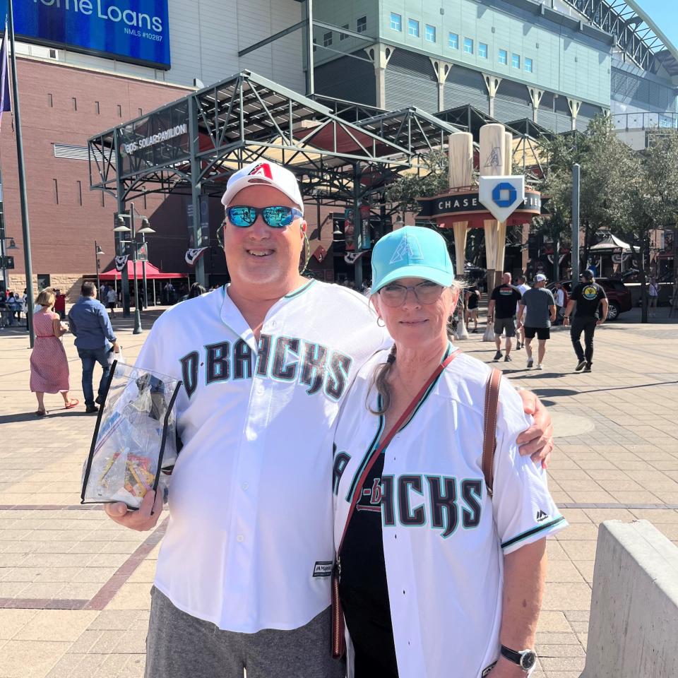 Pam and Michael Marek pose for a photo outside Chase Field on Oct. 19, 2023.