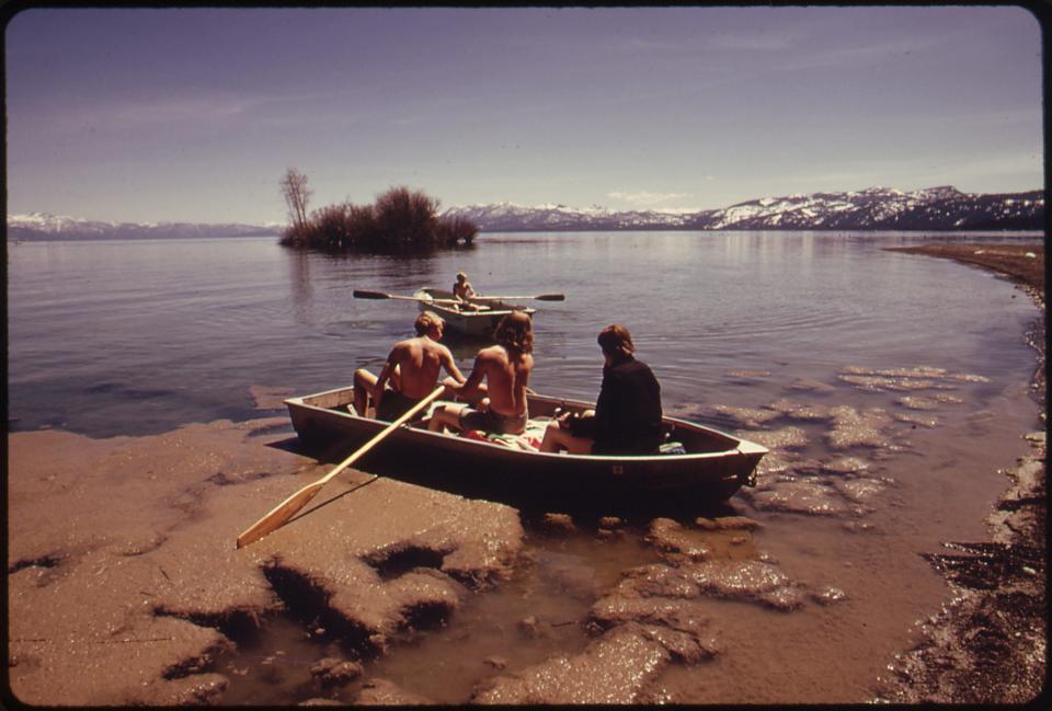 Scum smears the shoreline as boaters take off in May 1972 at Lake Tahoe.