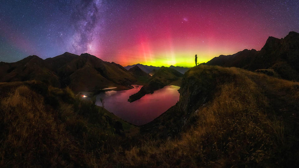 Purple, magenta and yellow northern lights over Moke Lake, New Zealand.