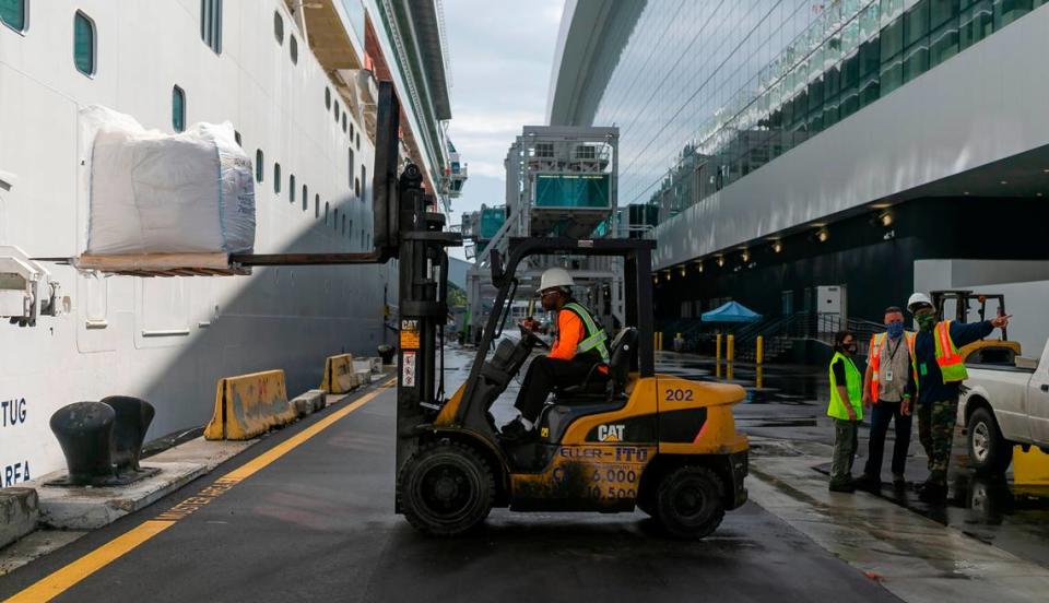 Longshoreman Kory Miles loads pallets onto a cruise ship at the Norwegian Cruise Line Terminal in PortMiami on Tuesday, February 16, 2021.