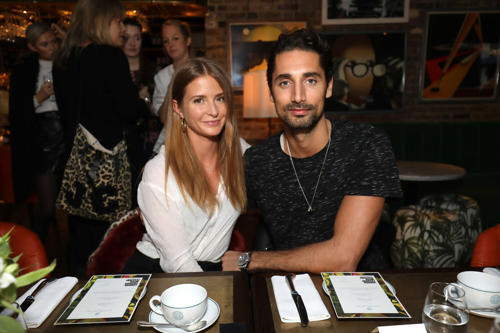 Millie Mackintosh and husband Hugo Taylor are thinking of taking their baby daughter on her first trip abroad, pictured at LFW in January 2018. (Getty Images)