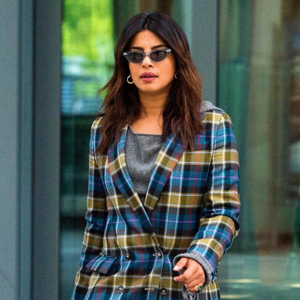 Priyanka Chopra arrived in London in the perfect pre-wedding look, a plaid suit by Alberta Ferretti.