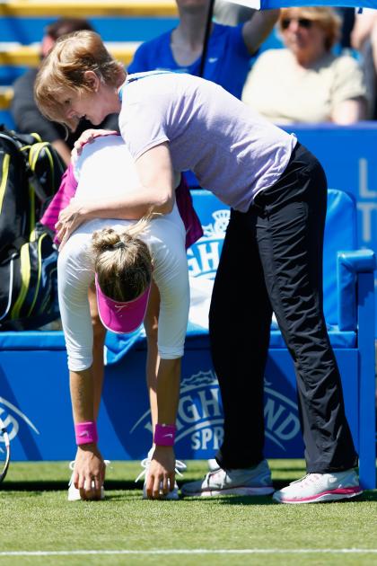 Bouchard went through a few quick stretches with the trainer, but didn't have treatment before she retired from her match against Belinda Bencic. (Photo by Julian Finney/Getty Images)