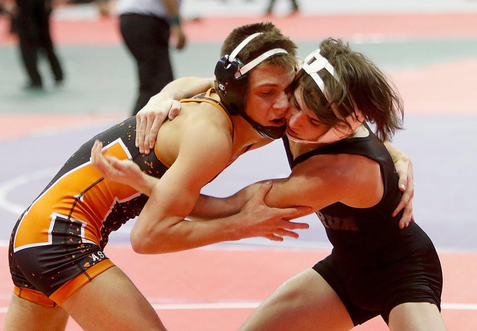 Ashland's Roman Parobek wrestles Minerva's Andrew Strader during their match Friday, March 11, 2022 at the OHSAA State Wrestling Championship at the Jerome Schottenstein Center in Columbus. TOM E. PUSKAR/TIMES-GAZETTE.COM