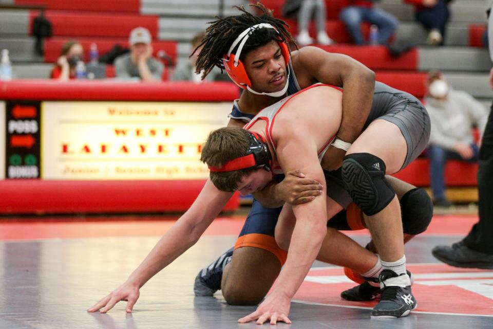 Harrison's Josh McKelvin, top, wrestles West Lafayette's David Curl during a 182 pound bout in an IHSAA wrestling meet, Friday, Jan. 21, 2022 in West Lafayette.